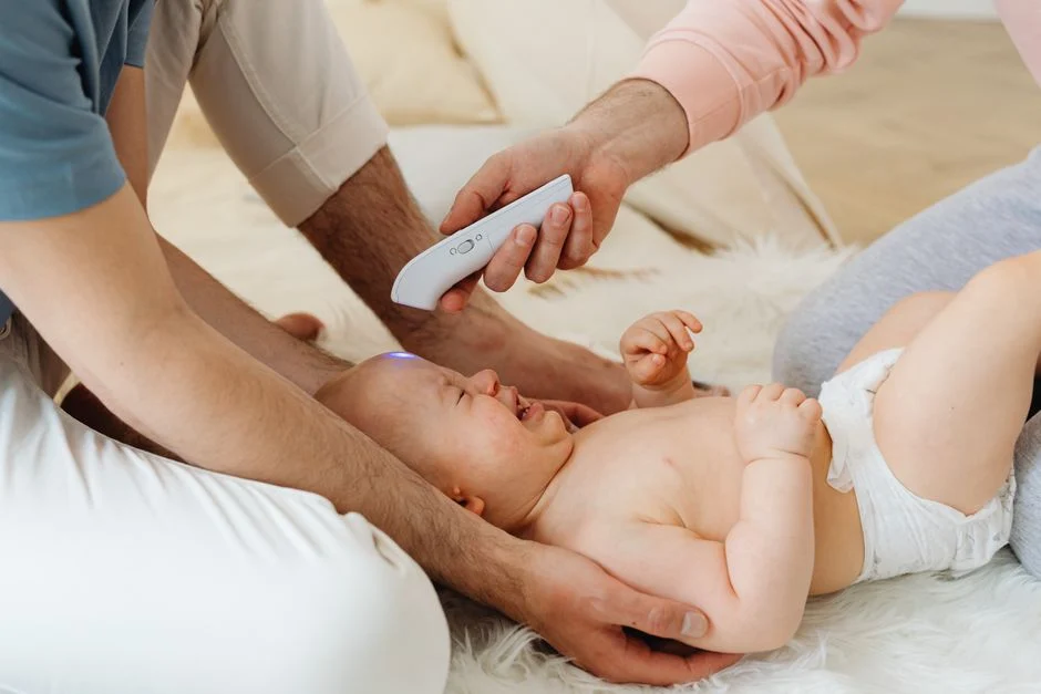 parent checking baby chest