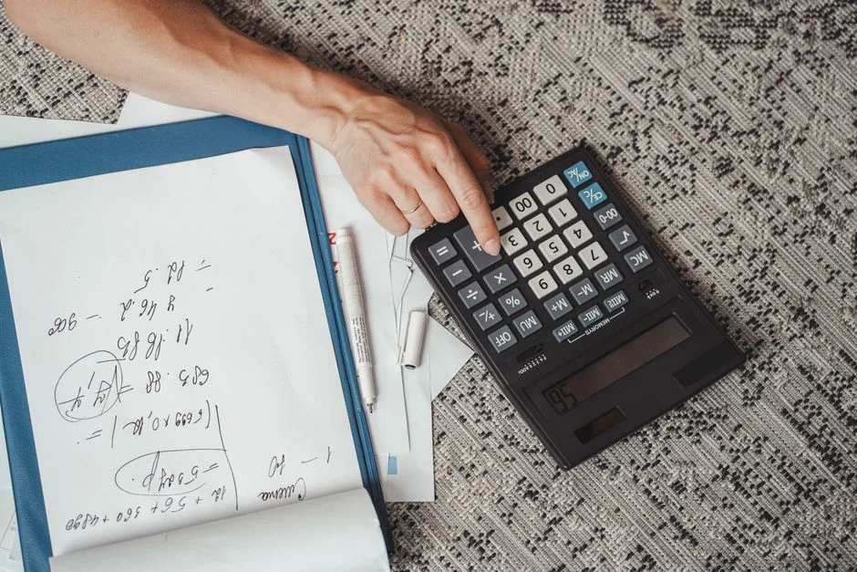person calculating energy consumption