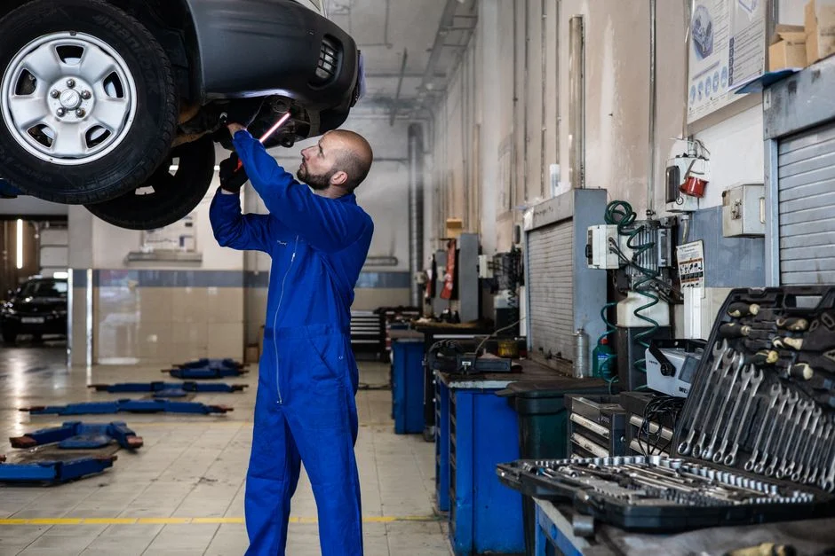 technician inspecting AC pipe