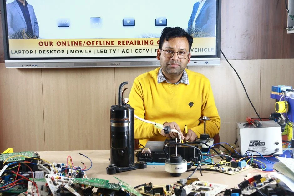 technician inspecting air conditioner unit